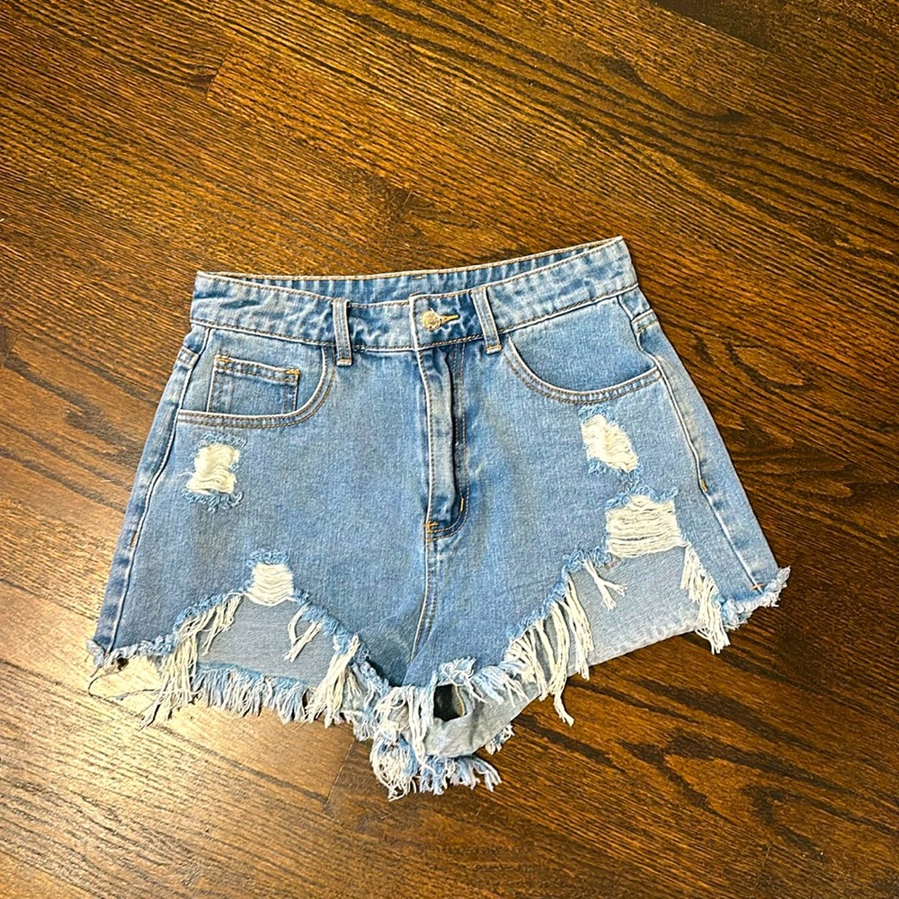 Ripped blue Jean shorts